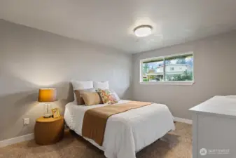 Spacious primary bedroom with walk in closet and full bath