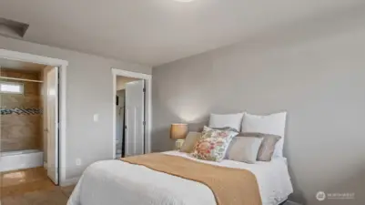 Primary showing the walk-in closet and full bathroom