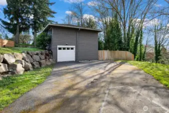 A full-sized SUV fits in that one car garage.  Otherwise, you have a lot of room for parking on this large driveway area.