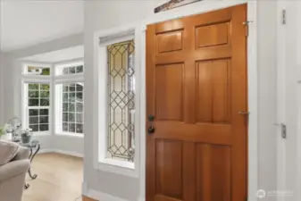 Front door, beautiful glass side light and bay window in Living Room