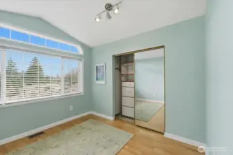 Spacious bedroom with built ins saving floor space