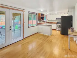 Large Dining Room with French Doors that lead to the covered patio.