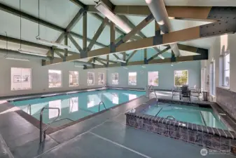 Swim, soak, and recharge in the spacious indoor pool area with hot tub.