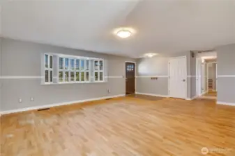 Living room viewing hallway to bedrooms. Hardwood oak floors in living and bedrooms. (no carpets!)