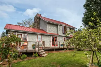 West side of the main home, with Fiberon decking and sunsets galore