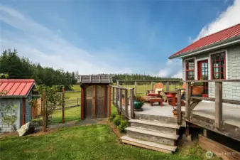 Gate from the west side deck out to the pasture and one of the ponds