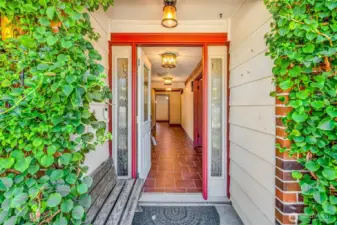 Gorgeous entry with ivy on the bricks