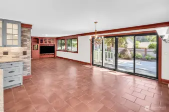 Massive dining space with custom sliding glass door to backyard