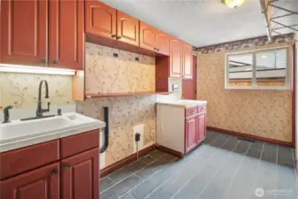 Laundry room with brand new tile flooring
