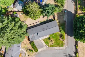 Get a true sense of space with this aerial view of the North Hill rambler. Situated on a corner lot with a spacious backyard and deck, this home offers privacy in a quiet double cul-de-sac setting.