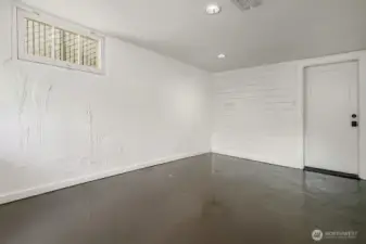 The garage interior provides clean, versatile space with direct access to the home.