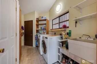 Laundry area with lots of storage.