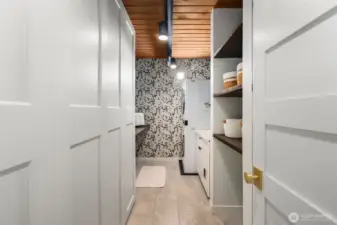 And just off the office is a massive laundry room with storage and folding counter.