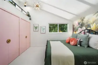 Above the closet we designed a reading nook with transom windows.