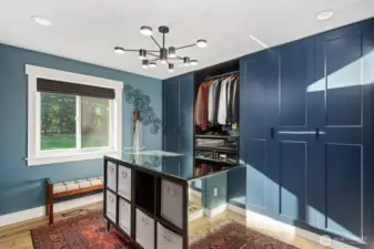 Primary walk-in closet - 1/2 of built-ins shown