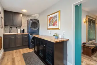 Laundry room with utility sink and wine cooler