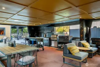 Entertaining pavilion with 2 sinks, commercial stove, BBQ, Argentinian grill & lots of seating