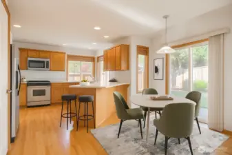 Dinning area off of kitchen with access to the back yard. virtually staged