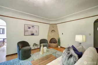 Quaint electric light fireplace for ambiance.