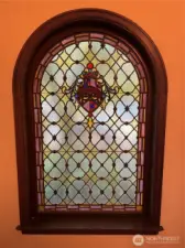 Leaded/stained glass window in entry of complex.