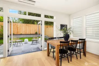 Ample dining space and French doors leading out to patio and private yard