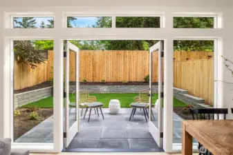 French doors leading out to patio and private yard