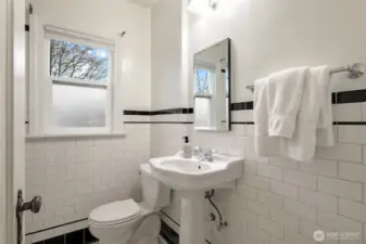 Updated hall bathroom with periodic detailing