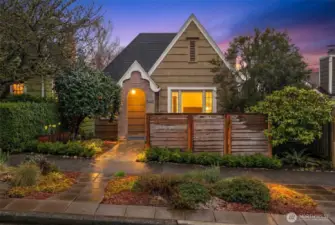 Gorgeous curb appeal with mature trees & shrubs, and street side plantings