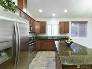 Granite countertops. Recessed Lighting. Custom Cabinets.