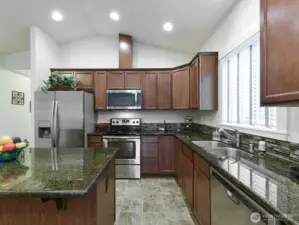 All stainless appliances stay w/ sale. Tile backsplash.