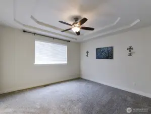 Primary bedroom. Coffered Ceiling/ Fan/light.
