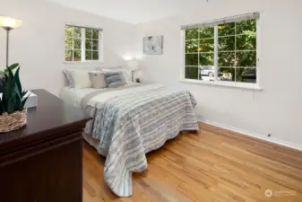 Bedroom 2 of 4 sits at front of house. So much greenery outside the windows!