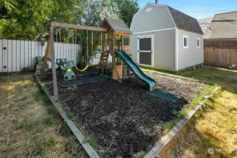 Upper level back yard features great swing set (stays with property) and fantastic Tuff Shed for even more storage options!