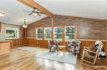 large open living room with wood walls