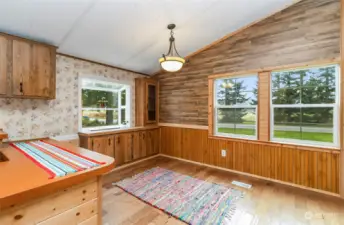 Wood walls off dining area-with built in storage