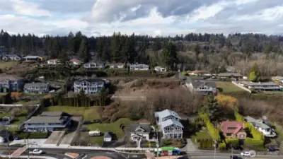 Drone shot looking west to building lot before construction.