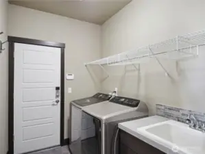 Laundry room, also note that this home is equiped with a security system.