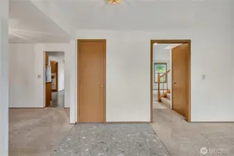 Once you enter, the formal living room is located to the right and the formal dining room is to the left. It's a wonderful circular floor plan. There is a coat closet direcly in front for ease.