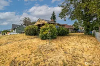 This large corner lot has so much potential. Grow your own vegetable garden or plant an english rose garden; the options are endless.