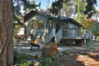 Views of the back deck with the white door that leads to the sunroom.