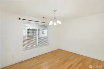 Another angle of the dining room showing light streams through these 2 windows.