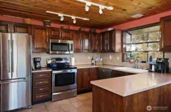 Kitchen - Electric stove top and SS appliances.