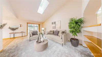 Living Room Graced by 2 Skylights & Access to the Hot Tub (Virtually Staged)
