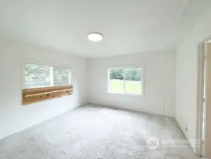 Primary Bedroom. Boards used as Headboard for placing bed in center of the room.