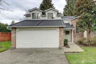 Two car attached garage. Note newer roofs, gutters and downspouts.