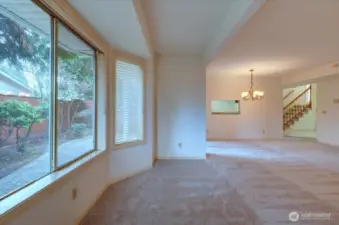 View from the living room back towards the dining room with pass thru and the entry area.