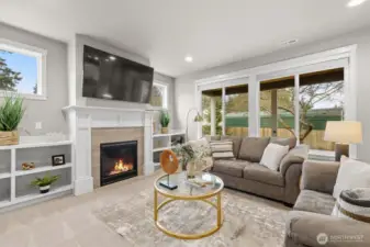 Living room with gas fire and built ins + all new plush carpeting