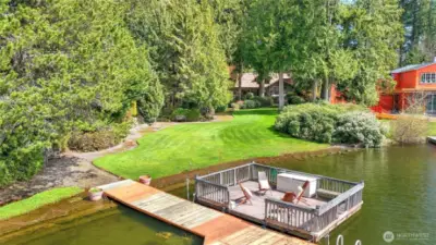 Private dock with detachable, motorized floating barge for enjoying Pine Lake.