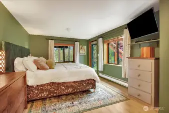 The primary bedroom which has a door to the yard