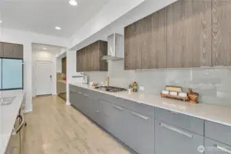 From the kitchen looking into the butler's pantry and wet bar to the oversized walk-in pantry.